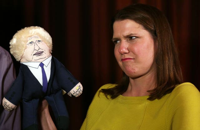 Jo Swinson with a Boris Johnson puppet