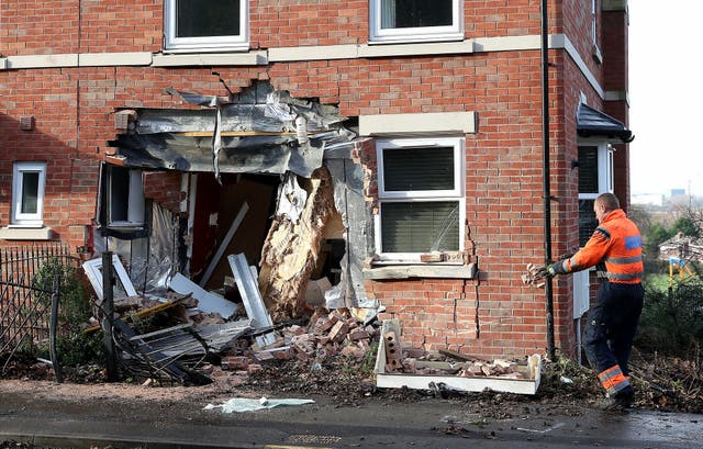 A gaping hole left in a house on Chester Road in Helsby, Cheshire after a gritting lorry crashed into it (Martin Rickett, PA Wire)