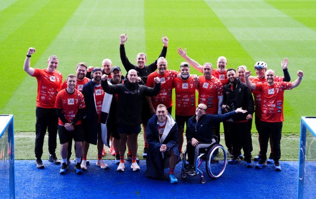 Sir Kevin Sinfield and his team cheering ahead of day five of their challenge