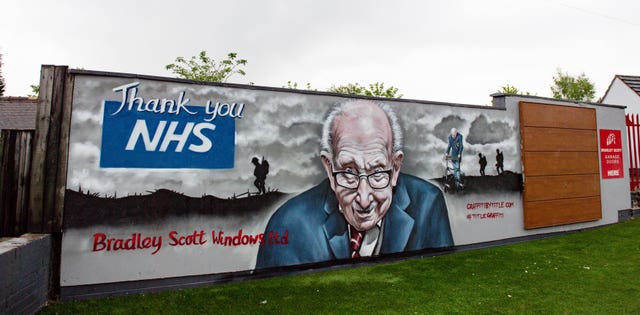 A mural paying tribute to NHS fundraiser Captain Tom Moore outside Bradley Scott Windows in Tamworth, Staffordshire