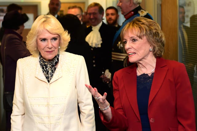 The Duchess of Cornwall with Dame Esther Rantzen (right) during a visit to the Blackpool offices of the Silver Line. Richard Martin-Roberts/PA Wire