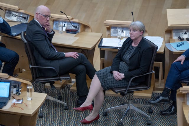 John Swinney and Shona Robison seated in the Holyrood chamber