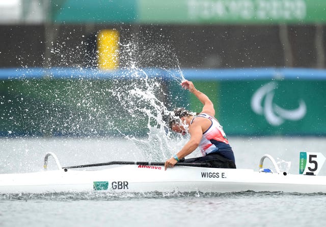 Great Britain's Emma Wiggs punches the water following Paralympic gold in the va'a discipline of paracanoe