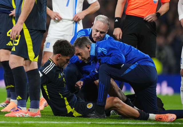 Aaron Hickey is treated by the physios