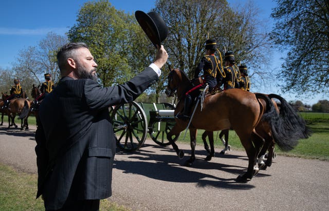 A man salutes the King’s Troop Royal Horse Artillery