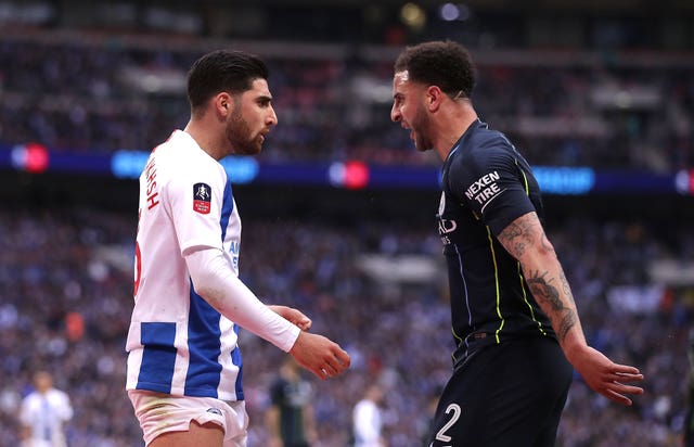 Kyle Walker, right, reacts to Alireza Jahanbakhsh's challeng