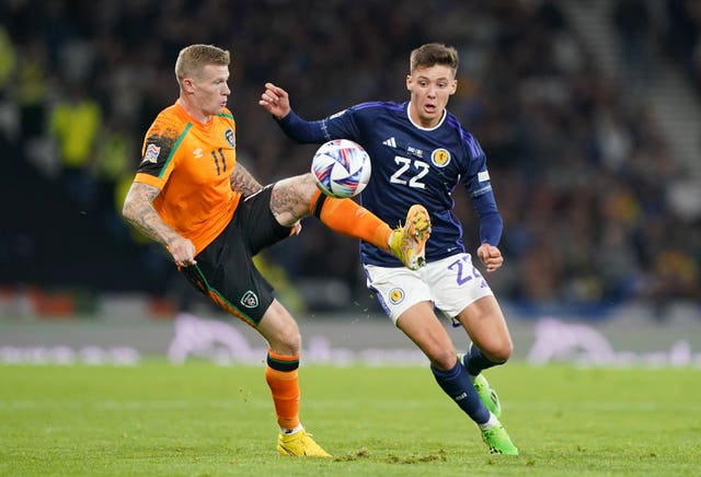 James McClean watched by Aaron Hickey