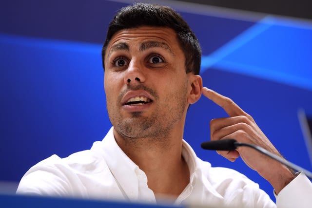 Manchester City midfielder Rodri faces the media