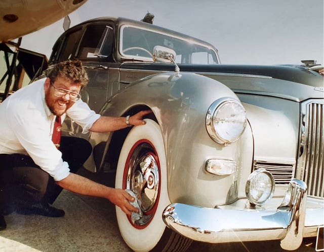 Allan Marshall polishing the wheels on his father’s Humber
