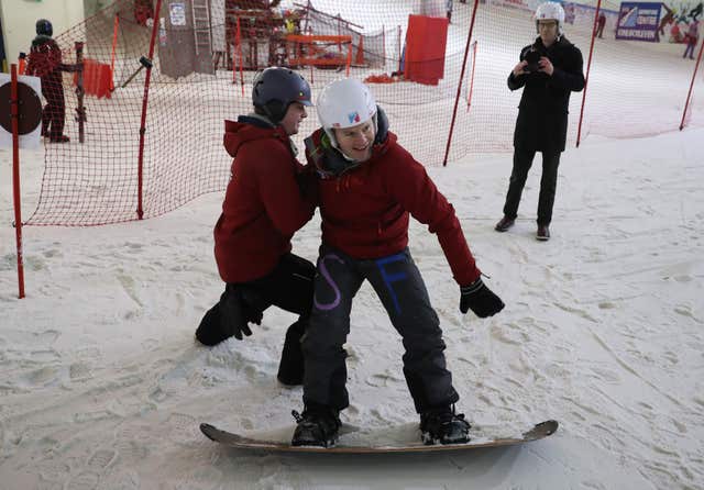 Derek Mackay has snowboarding lesson