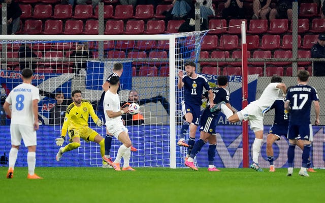 Craig Gordon makes a save in Greece