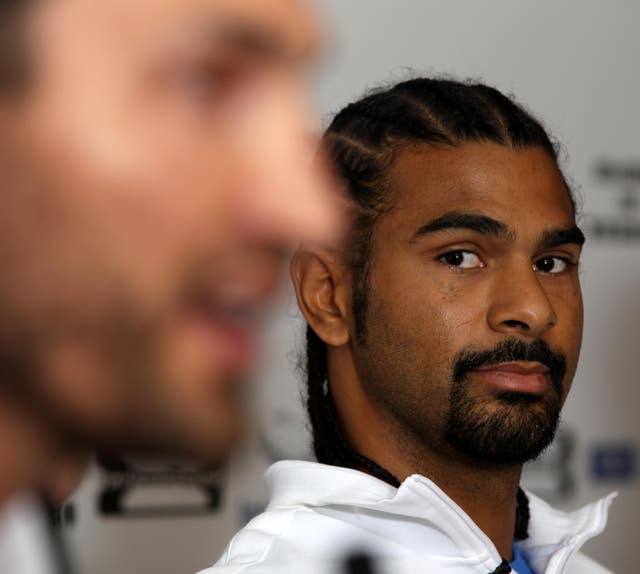 David Haye keeps an eye on Wladimir Klitschko, left, during a pre-fight press conference