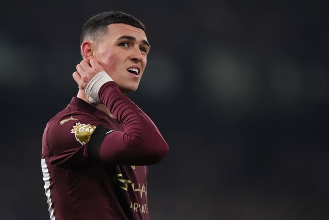 Phil Foden grimaces during a Manchester City match