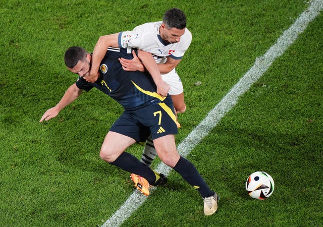 John McGinn battles for the ball with Switzerland''s Fabian Schar