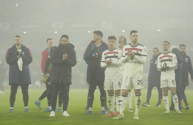 Ruben Amorim (second left) and his players applaud the fans