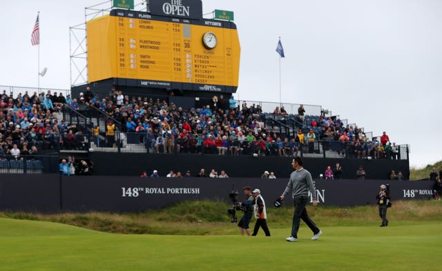 Rory McIlroy feels the crowd's support on the 18th