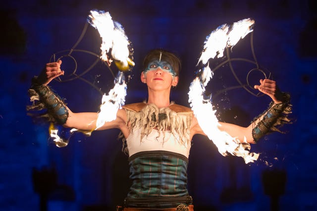 The Celtic Fire Theatre company PyroCeltica perform in front of Edinburgh Castle Esplanade