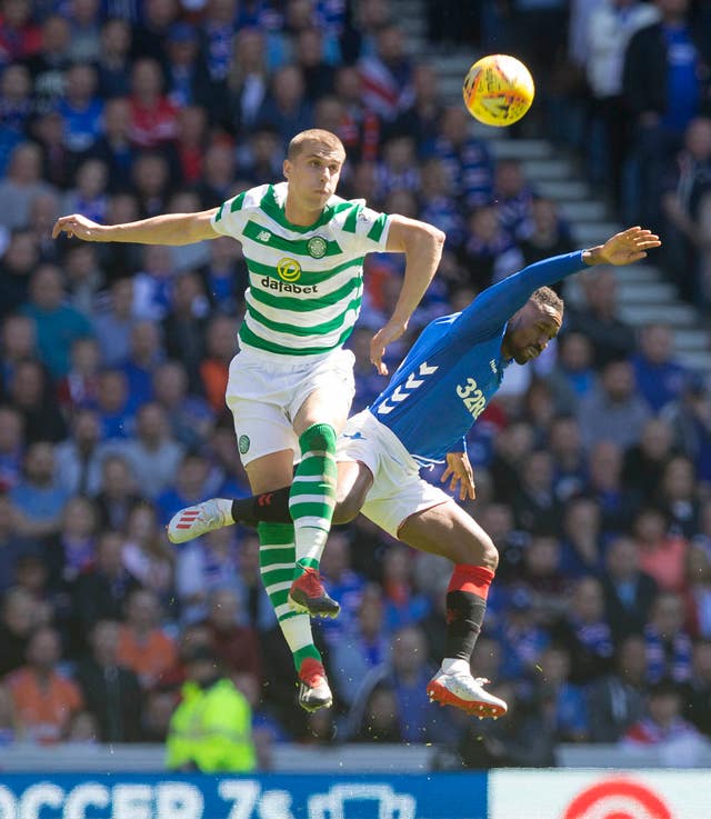 Celtic’s Jozo Simunovic (left) has escaped punishment after clashing with Jermain Defoe