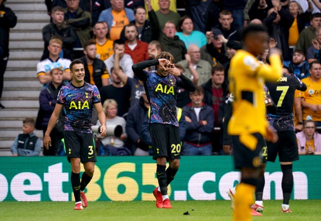 Dele Alli (centre) celebrates scoring