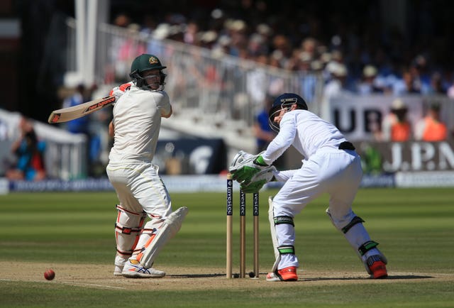 Jos Buttler, right, is beaten by a Steve Smith mis-hit