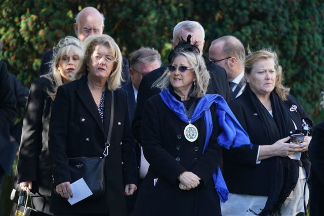 Mourners arrive for the funeral