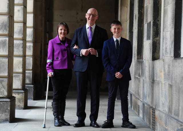 Elizabeth Quigley, John Swinney and their son Matthew smiling