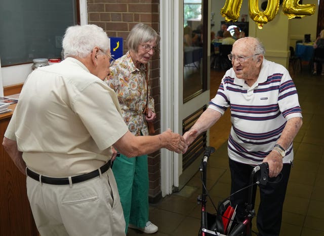 Monty Goldstein greeting guests