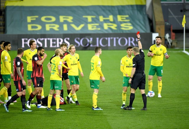 Dimitris Giannoulis was sent off for Norwich before Bournemouth came back to claim victory