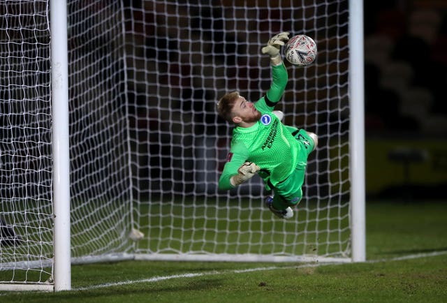Jason Steele atoned for an earlier error by  making four saves in the shoot-out as Brighton avoided a cup upset at League Two Newport 