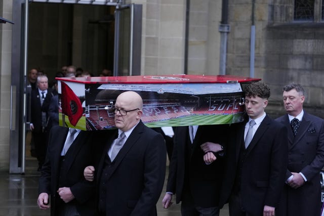 The coffin of Harvey Willgoose is carried out of Sheffield Cathedral after his funeral