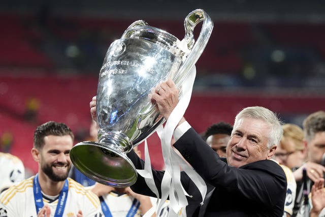 Carlo Ancelotti lifts the Champions League trophy after success with Real Madrid in 2024