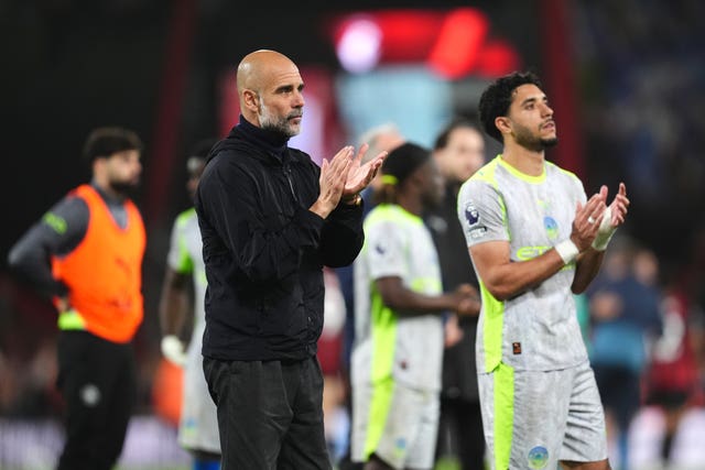 Pep Guardiola (left) and players applaud the fans
