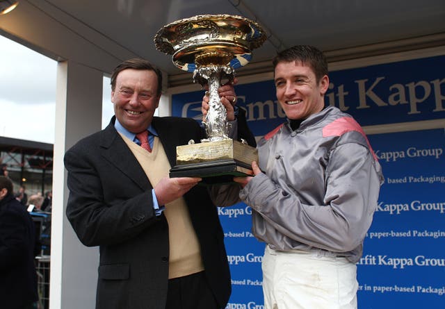 Nicky Henderson with Barry Geraghty after winning the Champion Hurdle with Punjabi