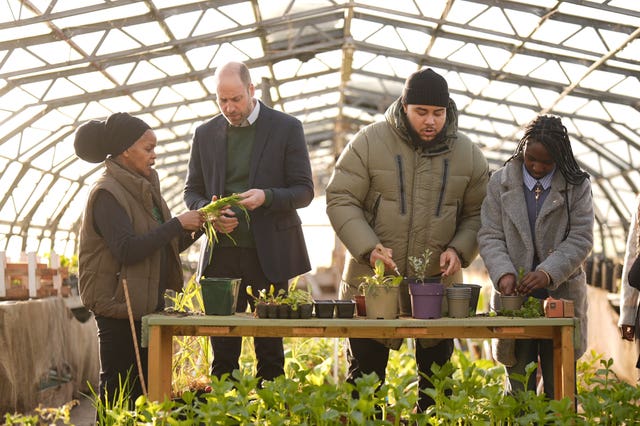 Prince of Wales with Paulette Henry and Big Zuu in a greenhouse