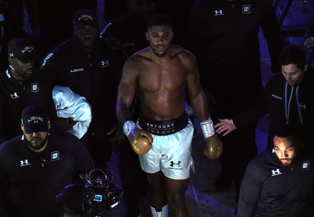Anthony Joshua walks to his dressing room