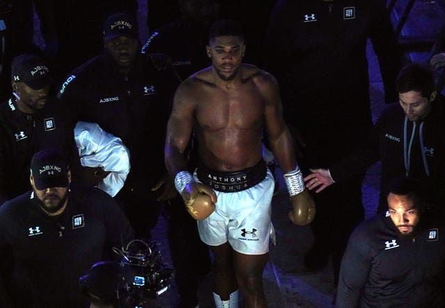 Anthony Joshua walks to his dressing room 