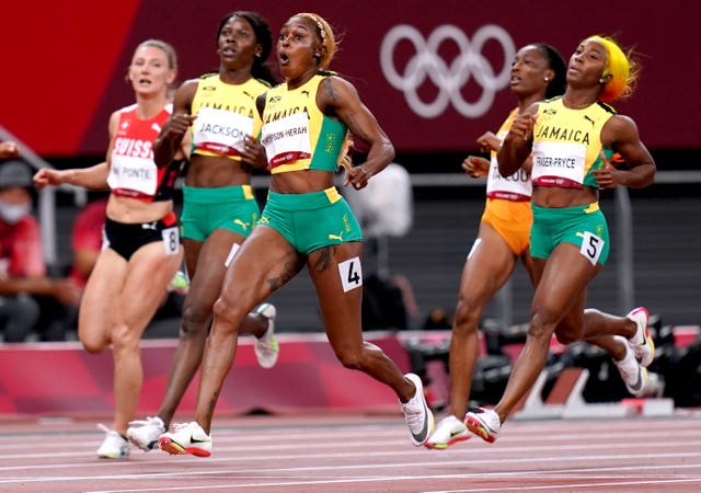 Jamaica enjoyed a clean sweep in the women's 100m final as Elaine Thompson-Herah, centre, took gold