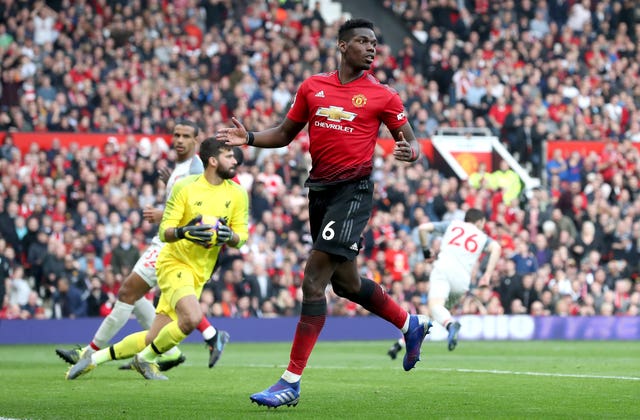 Paul Pogba reacts after seeing his shot saved by Liverpool goalkeeper Alisson Becker 