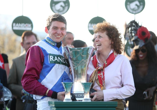 Jockey Derek Fox and trainer Lucinda Russell celebrate after winning the Grand National