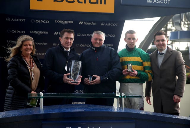 Tony McCoy (centre-left) is all smiles after lifting the Betfair Ascot Chase trophy