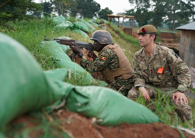 Pierre Ozanne from the British Army helps train a Ugandan soldier in Singo