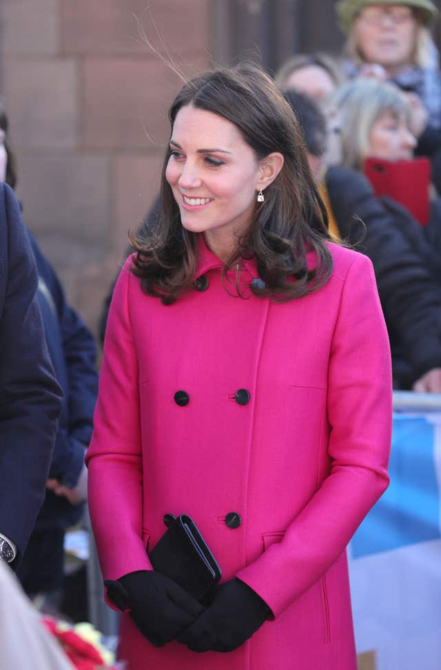 The Duchess looked fantastic, as always, in a striking pink coat (Aaron Chown/PA)