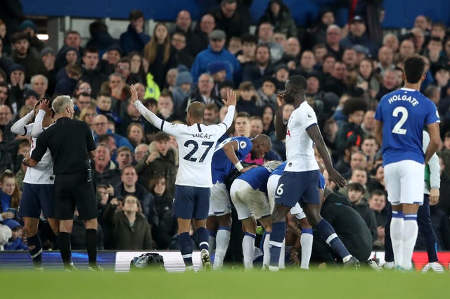 Son, left, holds his head in his hands after the injury to Andre Gomes