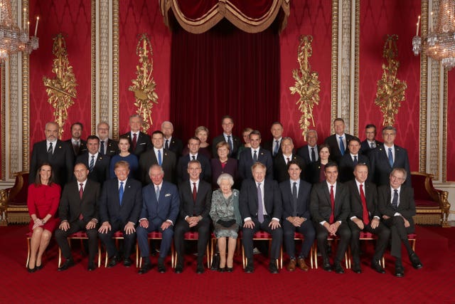 Leaders of Nato alliance countries and its secretary general join the Queen and the Prince of Wales for a group picture during a reception in Buckingham Palace