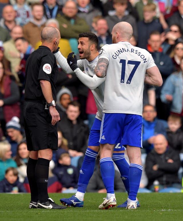 Cardiff's Victor Camarasa confronts Mike Dean after the referee overturned a penalty decision 