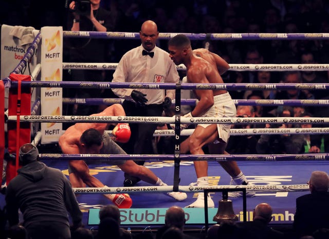 Anthony Joshua, right, knocks Wladimir Klitschko to the canvas