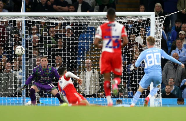 Cole Palmer (right) was among Manchester City's scorers against Wycombe (Barrington Coombs/PA).