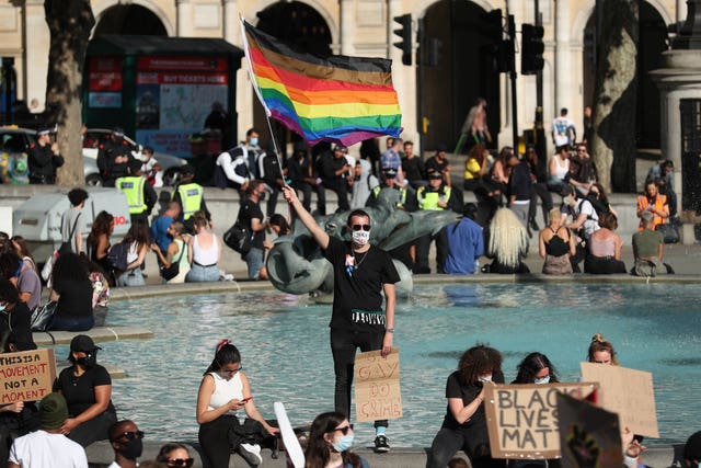 People gather in Trafalgar Square, London, after marching through central London following a Black Lives Matter rally in Hyde Park