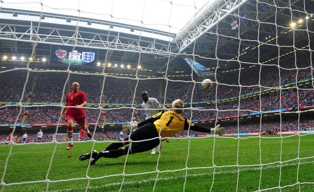 Darren Bent (centre) scores England's second goal in Wales' last match at the Principality Stadium (Owen Humphreys/PA)