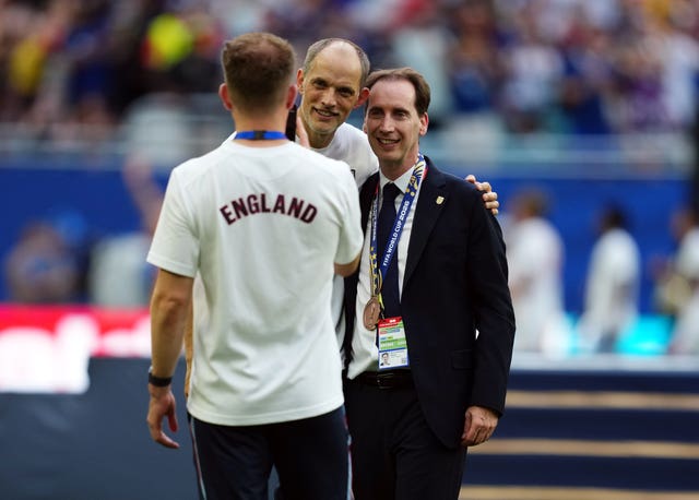 Thomas Tuchel, centre, talks to FA chief executive Mark Bullingham, pictured right wearing Tuchel’s World Cup bronze medal